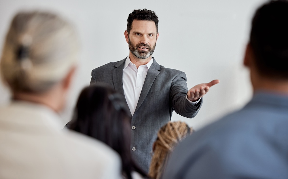A speaker engaging directly with an intimate audience